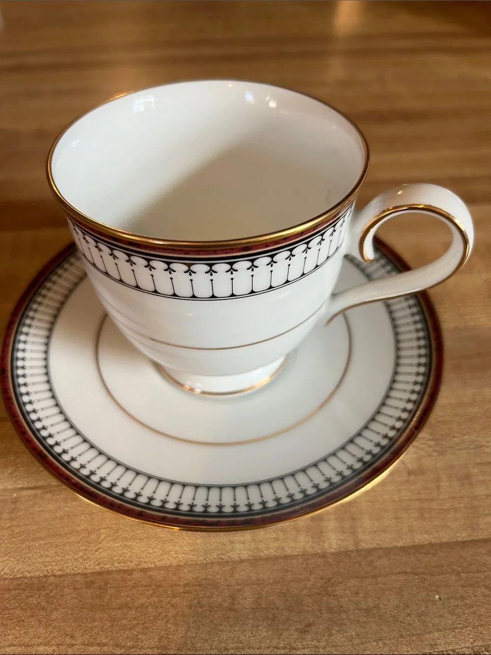 Noritake White Fine China Cup and Saucer with a Black/Maroon/Gold Band